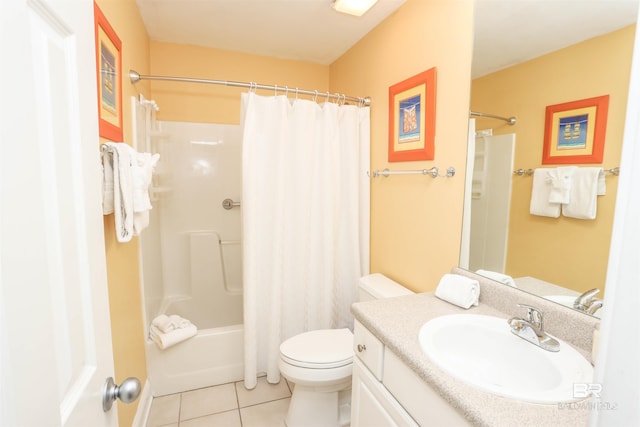 bathroom featuring shower / bathtub combination with curtain, vanity, toilet, and tile patterned floors