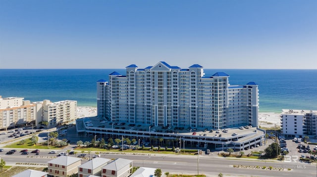 drone / aerial view with a water view, a view of city, and a view of the beach