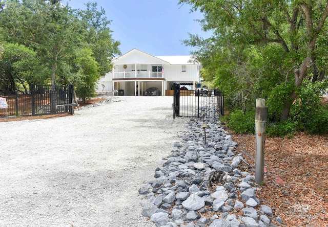 32130 River Rd, Orange Beach, AL 36561 - view of front facade with a gate
