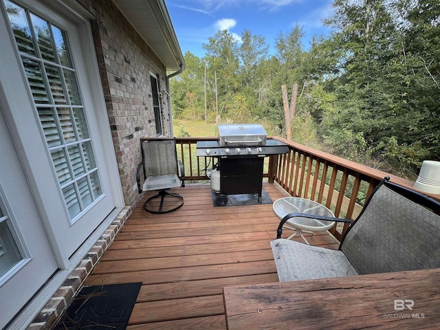 wooden deck featuring grilling area