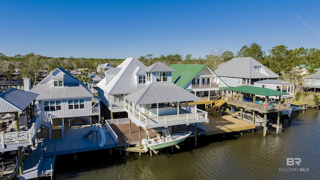 dock area featuring a residential view and a water view