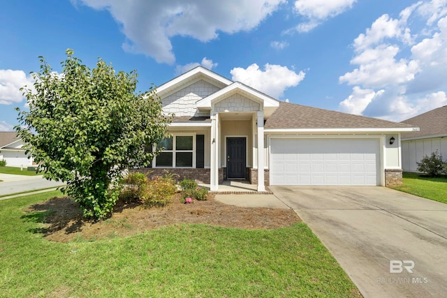 view of front of house featuring a garage and a front lawn