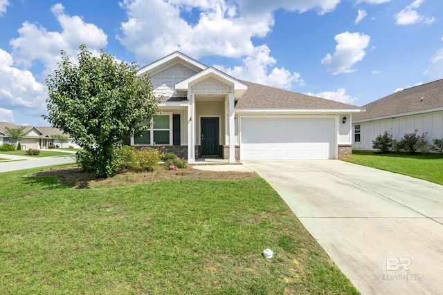 view of front of home with a front yard and a garage