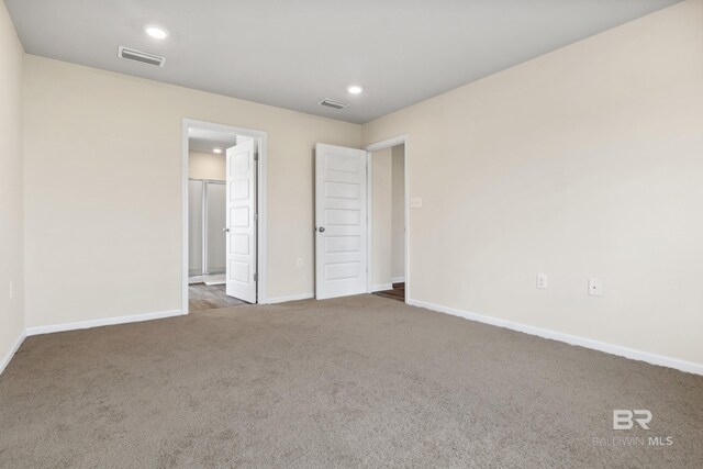 bathroom with vanity, plus walk in shower, and hardwood / wood-style flooring