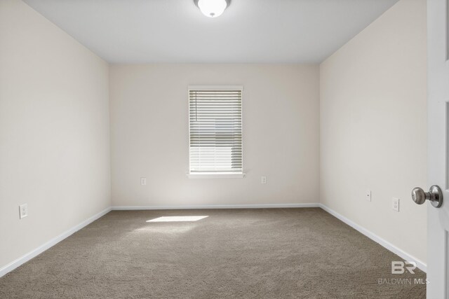 unfurnished room with carpet floors