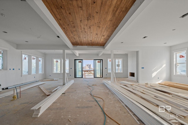 16880 Brigadoon Trl, Gulf Shores, AL 36542 - spare room featuring a baseboard heating unit and a wood ceiling with exposed beams