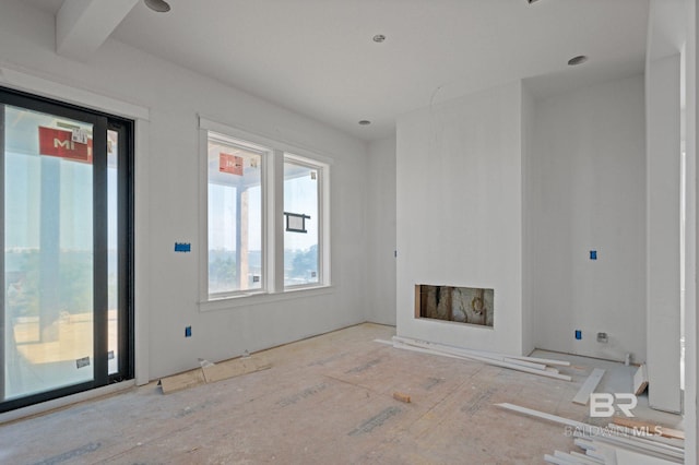16880 Brigadoon Trl, Gulf Shores, AL 36542 - unfurnished living room with healthy amount of natural light