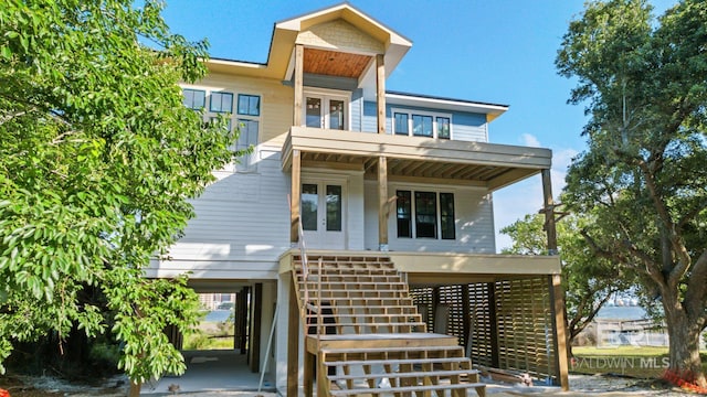 16880 Brigadoon Trl, Gulf Shores, AL 36542 - view of front of property featuring french doors, stairs, and a porch
