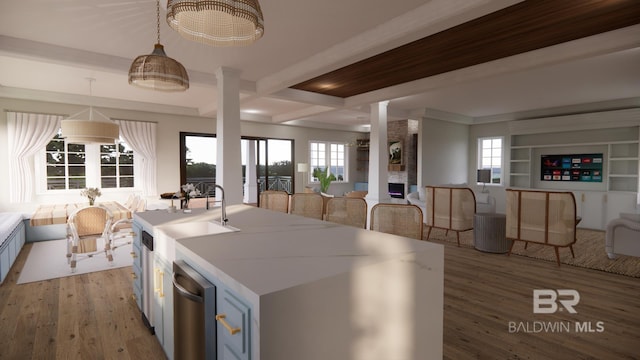 16880 Brigadoon Trl, Gulf Shores, AL 36542 - kitchen featuring open floor plan, light wood-style floors, healthy amount of natural light, beamed ceiling, and coffered ceiling