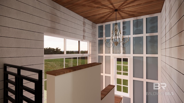 16880 Brigadoon Trl, Gulf Shores, AL 36542 - unfurnished sunroom with a chandelier and healthy amount of natural light