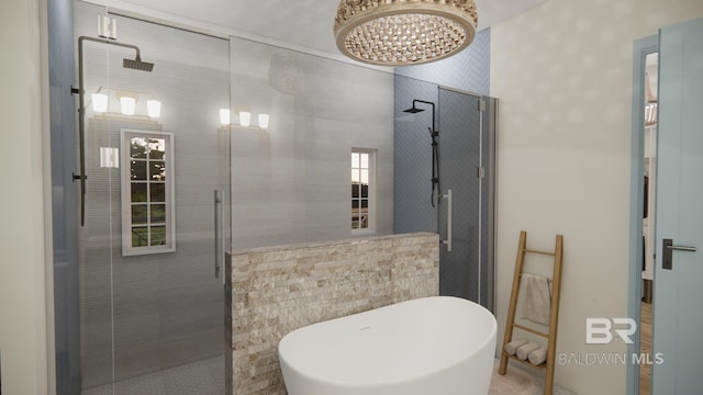 16880 Brigadoon Trl, Gulf Shores, AL 36542 - bathroom featuring tiled shower, a freestanding bath, and a chandelier