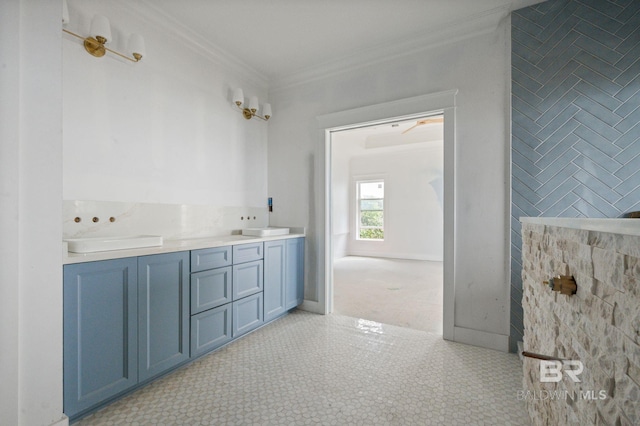 16880 Brigadoon Trl, Gulf Shores, AL 36542 - bathroom with ornamental molding and double vanity