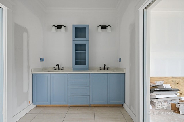 16880 Brigadoon Trl, Gulf Shores, AL 36542 - bathroom with crown molding, tile patterned flooring, and double vanity