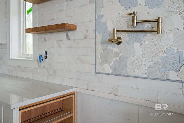 16880 Brigadoon Trl, Gulf Shores, AL 36542 - bathroom featuring healthy amount of natural light and decorative backsplash