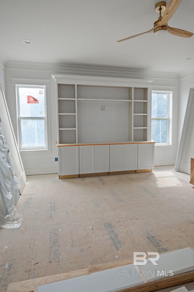 16880 Brigadoon Trl, Gulf Shores, AL 36542 - unfurnished living room featuring plenty of natural light, a ceiling fan, and ornamental molding