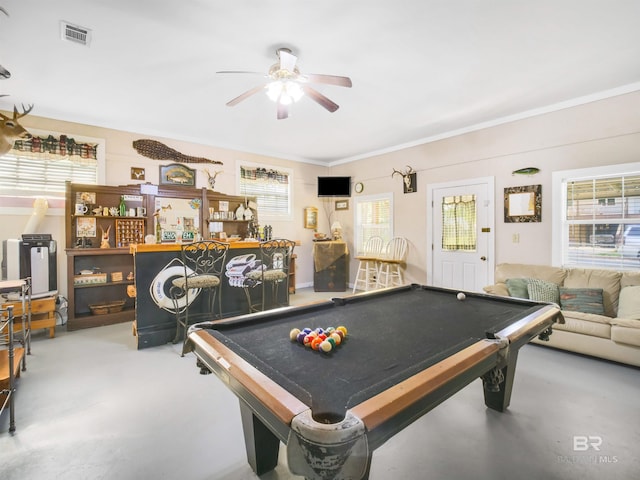 recreation room with bar, ceiling fan, plenty of natural light, and billiards