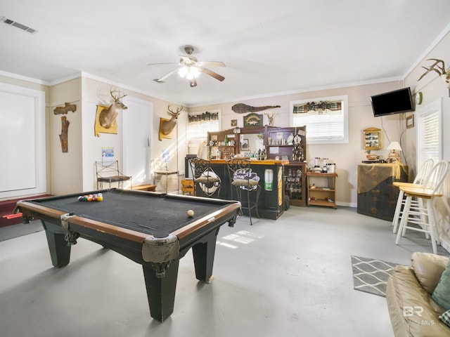 recreation room featuring bar area, billiards, ceiling fan, ornamental molding, and concrete flooring