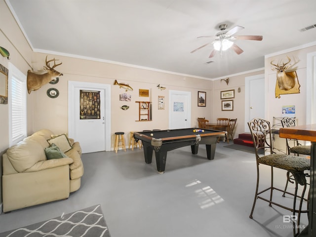 recreation room with crown molding, ceiling fan, concrete floors, and pool table