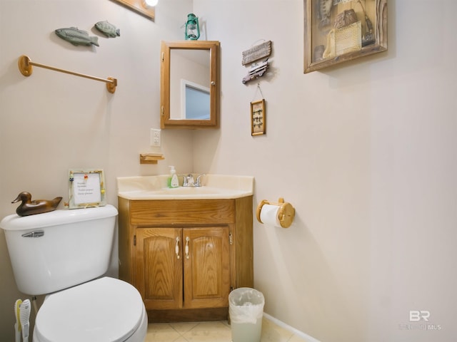 bathroom featuring tile patterned flooring, vanity, and toilet