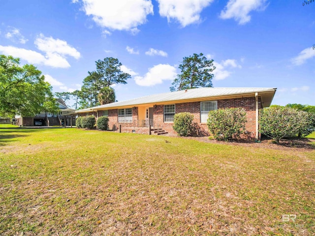 single story home featuring a front lawn