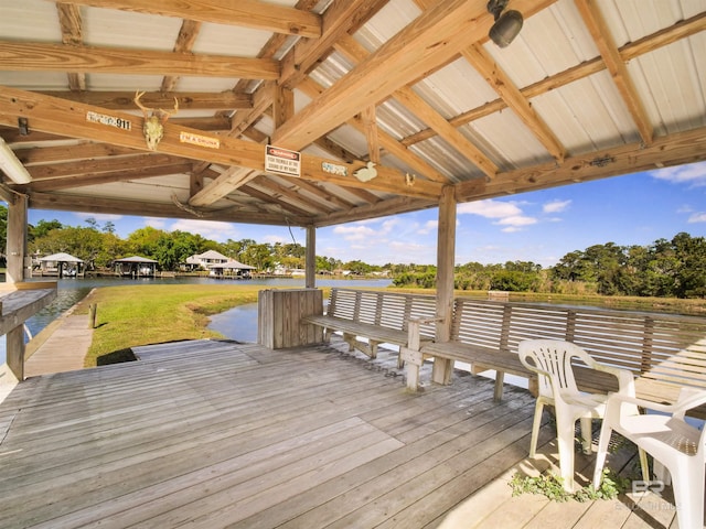 view of dock with a deck with water view and a gazebo
