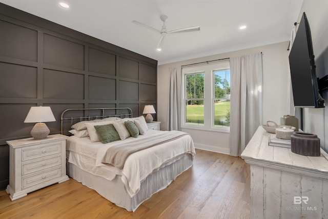 bedroom featuring ceiling fan and light hardwood / wood-style floors