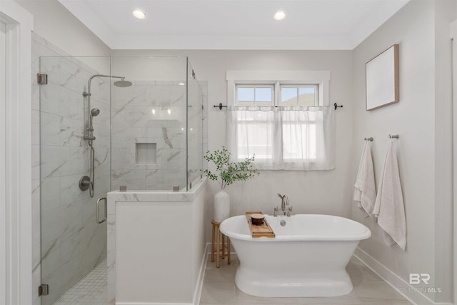 bathroom featuring tile patterned floors and separate shower and tub