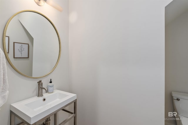 bathroom featuring toilet and sink