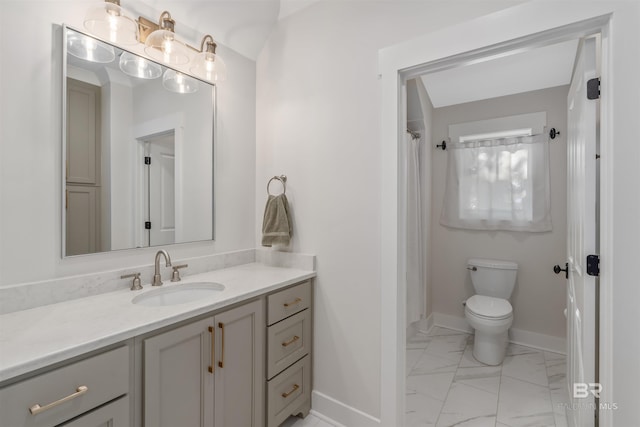 bathroom with vanity and toilet