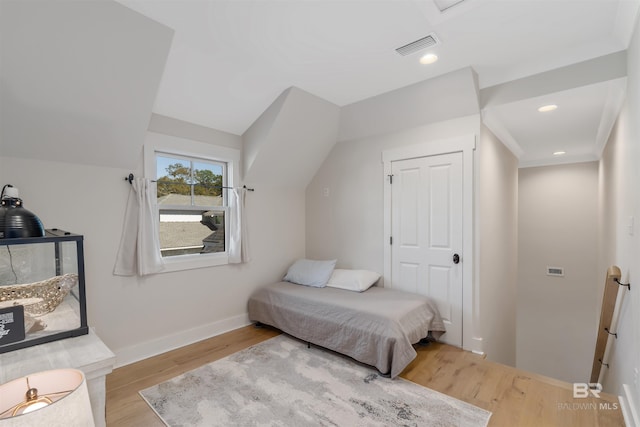 bedroom featuring a closet and light hardwood / wood-style floors