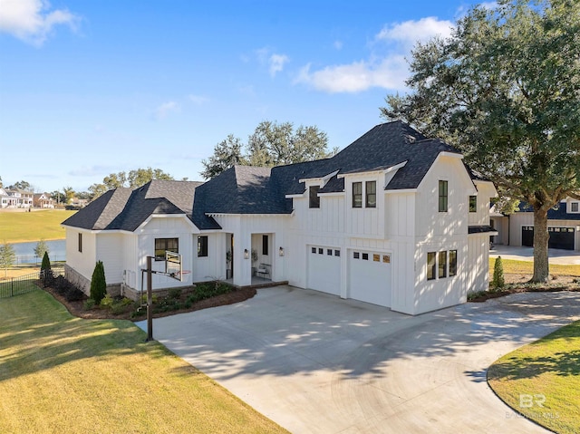 modern farmhouse with a garage and a front yard