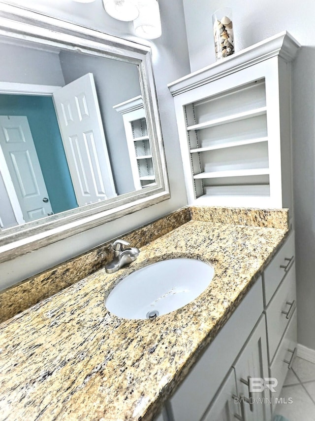 bathroom featuring tile patterned floors and vanity