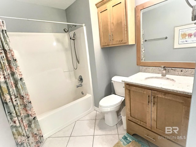 bathroom with tile patterned floors, vanity, toilet, and shower / bath combo with shower curtain