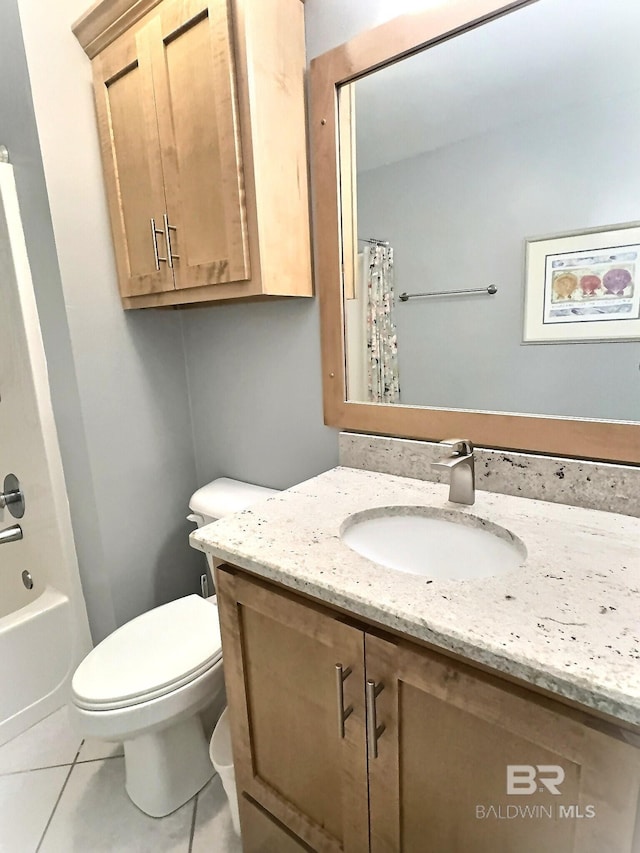 full bath featuring vanity, tile patterned floors, shower / tub combo, and toilet