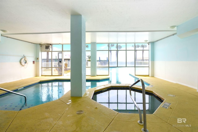 pool with an indoor in ground hot tub