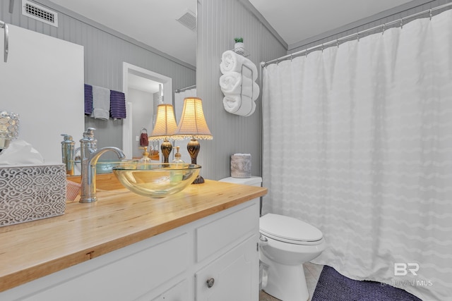 full bathroom featuring tile patterned floors, vanity, toilet, and visible vents
