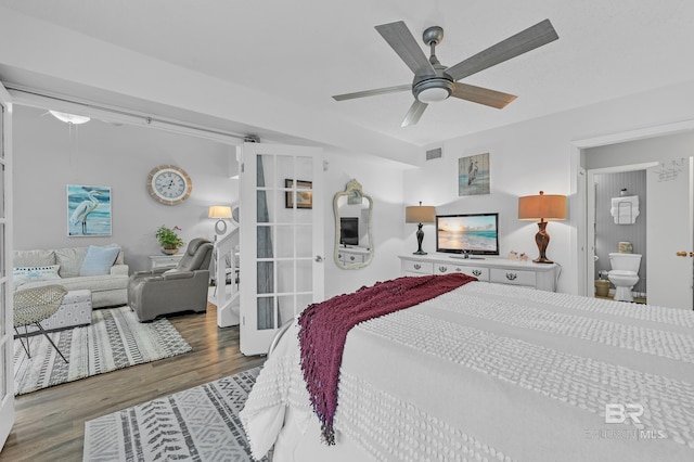 bedroom with visible vents, ceiling fan, wood finished floors, and french doors