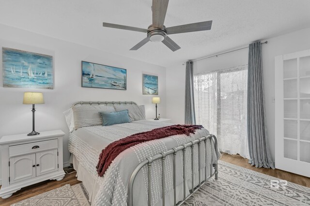 bedroom with light wood-style floors and ceiling fan