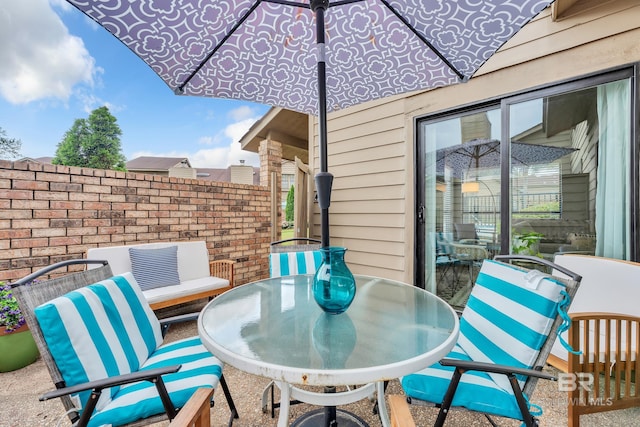 view of patio featuring outdoor dining area