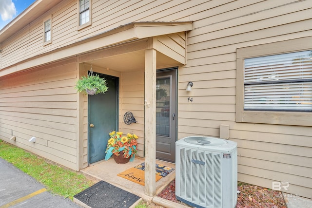 doorway to property featuring central air condition unit