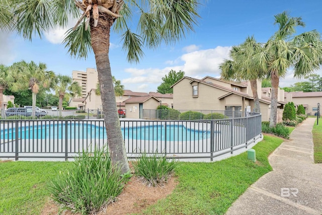 view of swimming pool with a fenced in pool and fence