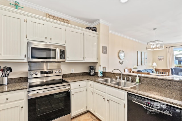 kitchen with sink, ornamental molding, appliances with stainless steel finishes, light tile patterned flooring, and white cabinetry