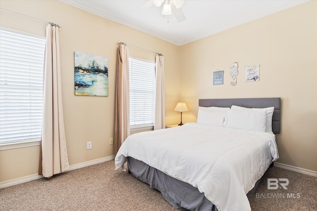 carpeted bedroom with ceiling fan and crown molding