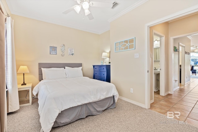 carpeted bedroom featuring ceiling fan and crown molding