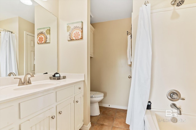 full bathroom with tile patterned floors, vanity, toilet, and shower / bath combo with shower curtain