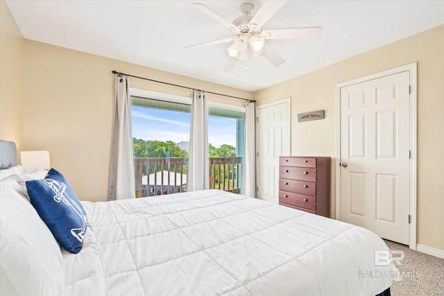 carpeted bedroom with access to exterior and ceiling fan