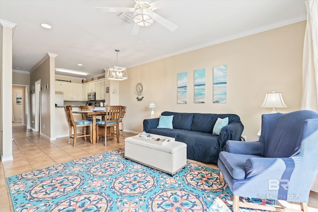 tiled living room with ceiling fan and ornamental molding