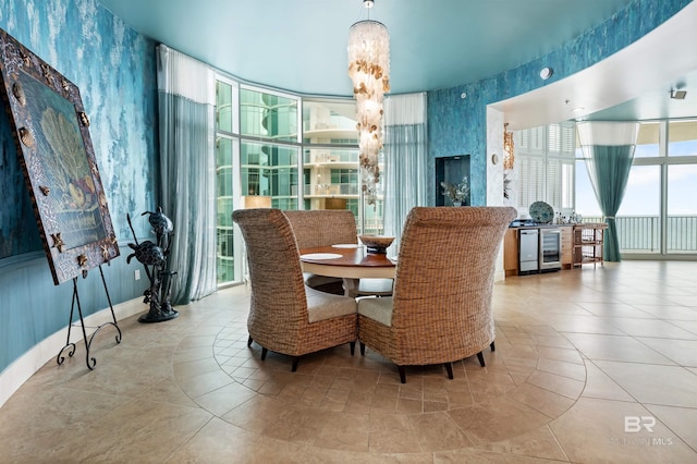 26302 Perdido Beach Blvd Unit D2201, Orange Beach, AL 36561 - dining space featuring wallpapered walls, wine cooler, plenty of natural light, and tile patterned floors