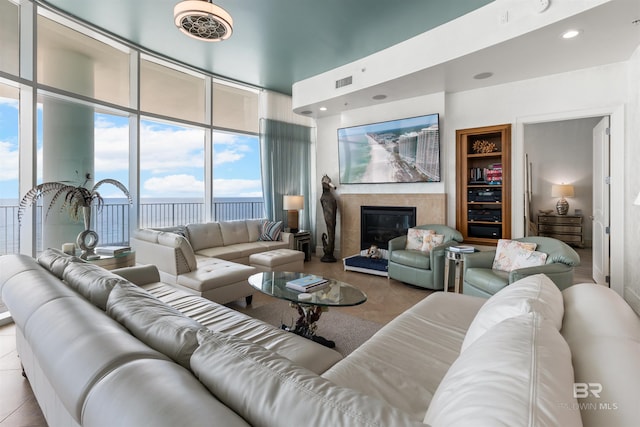26302 Perdido Beach Blvd Unit D2201, Orange Beach, AL 36561 - living room with a fireplace, plenty of natural light, expansive windows, and recessed lighting
