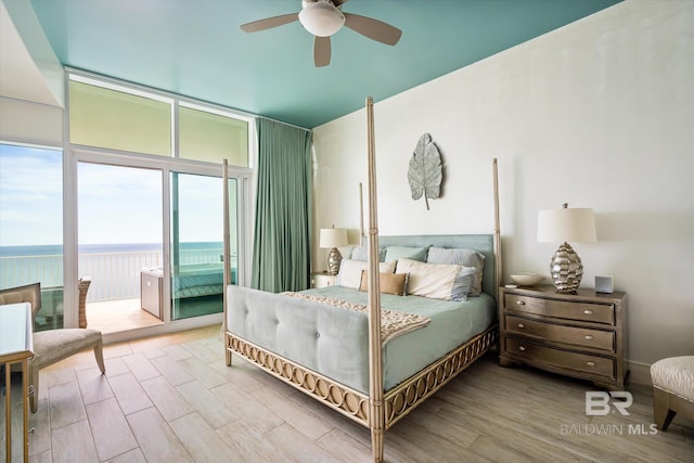 26302 Perdido Beach Blvd Unit D2201, Orange Beach, AL 36561 - bedroom with floor to ceiling windows, access to outside, wood finished floors, a ceiling fan, and a water view